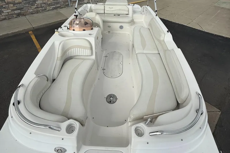 Slide: The Image of 2007 Smoker Craft Vectra 2040 boat interior with white seating and spacious layout. - 14