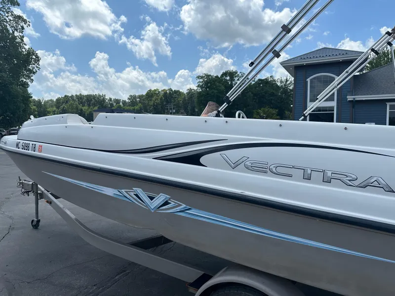 Slide: The Image of 2007 Smoker Craft Vectra 2040 boat on trailer under a partly cloudy sky. - 2