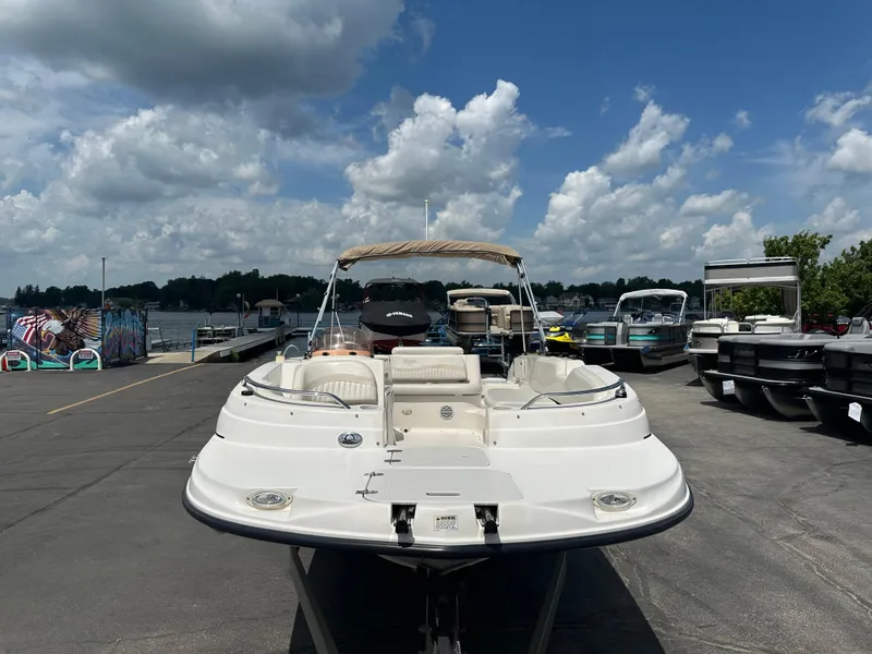 Slide: The Image of 2007 Smoker Craft Vectra 2040 boat docked under a cloudy sky. - 3