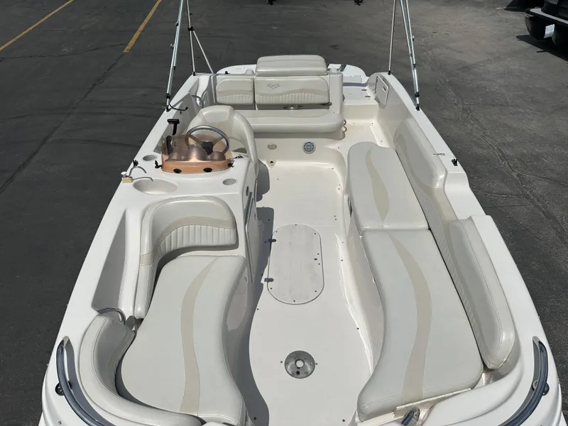 Slide: The Image of 2007 Smoker Craft Vectra 2040 boat interior with white seating and steering console. - 7
