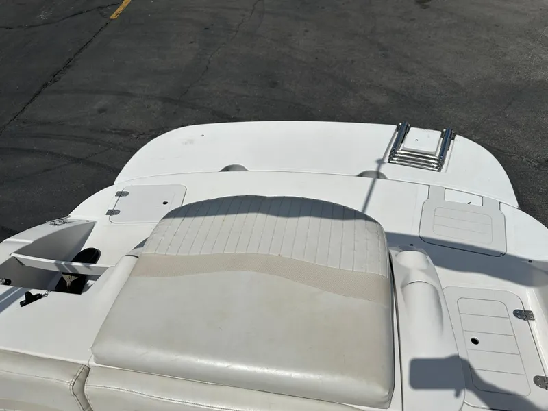 Slide: The Image of 2007 Smoker Craft Vectra 2040 boat interior with white seating and storage compartments. - 8