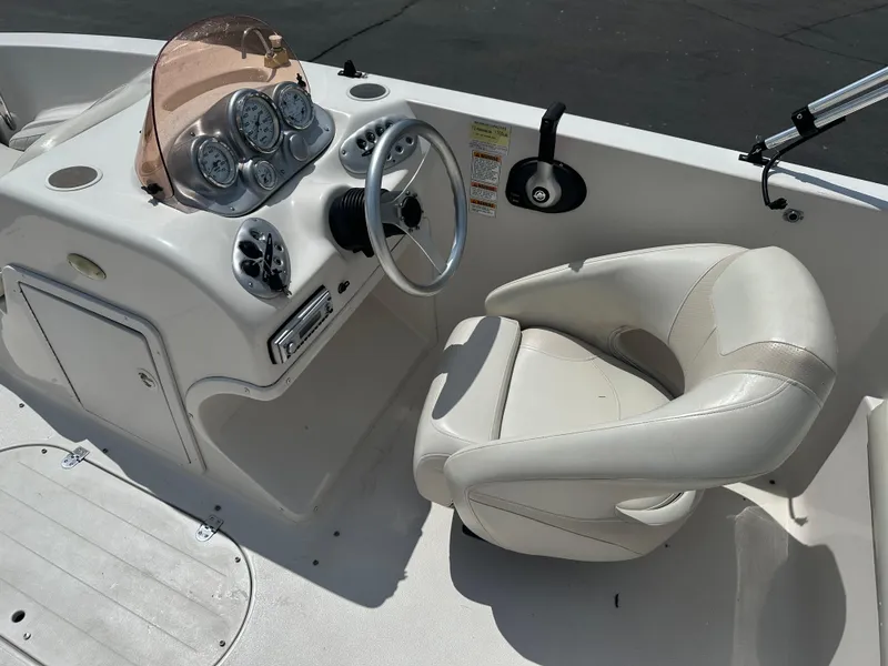 Slide: The Image of 2007 Smoker Craft Vectra 2040 boat cockpit with steering wheel and gauges. - 9
