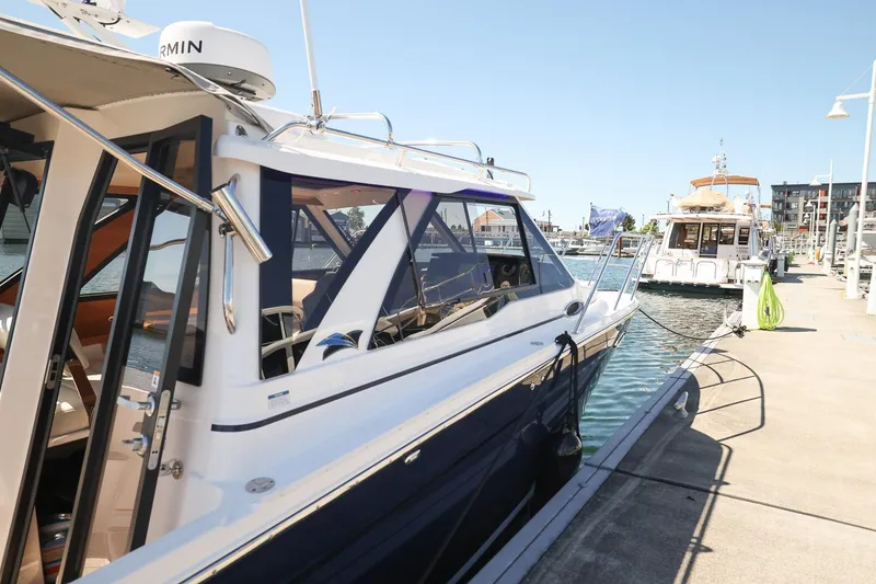 Slide: The Image of 2026 Cutwater C-248 Coupe docked at marina on a sunny day. - 13