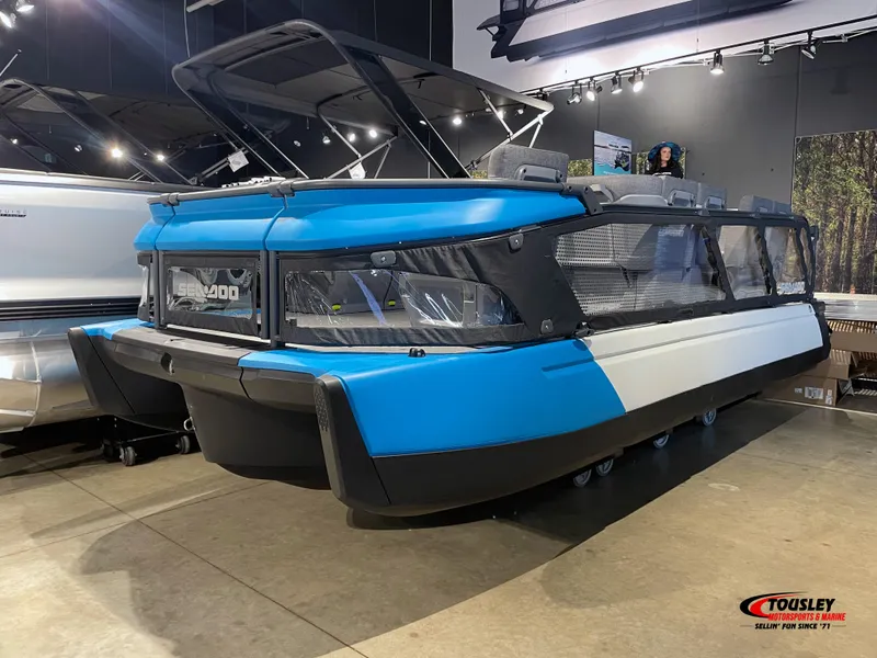 Slide: The Image of 2023 Sea-Doo Switch 19 - 170 HP pontoon boat displayed indoors. - 5