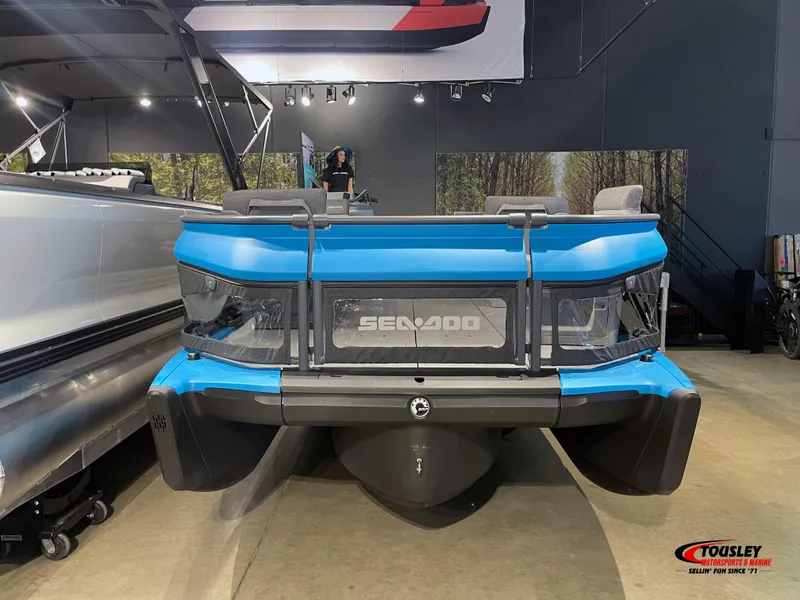 Slide: The Image of 2023 Sea-Doo Switch 19 - 170 HP pontoon boat displayed indoors, front view. - 7