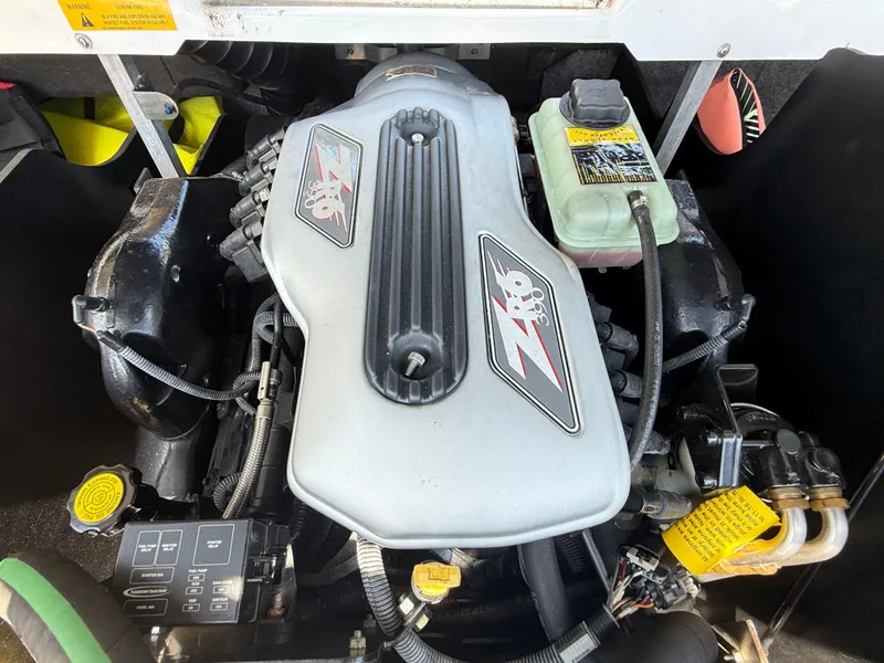 Slide: The Image of 2008 Nautique Super Air 230 engine compartment with ZR6 390 engine components visible. - 19