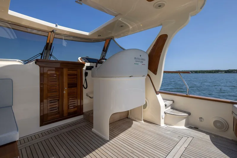 Slide: The Image of 2022 Fratelli Aprea 32 Hard Top yacht interior with wooden accents and helm station. - 12