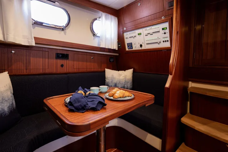 Slide: The Image of Fratelli Aprea 32 Hard Top 2022 interior with dining area and control panel. - 17