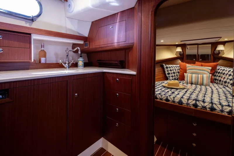 Slide: The Image of Luxurious 2022 Fratelli Aprea 32 Hard Top yacht interior with wood finish and cozy bedroom. - 18