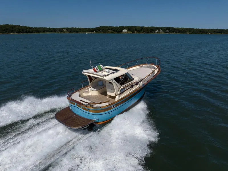 Slide: The Image of Fratelli Aprea 32 Hard Top 2022 cruising on open water, rear view. - 4
