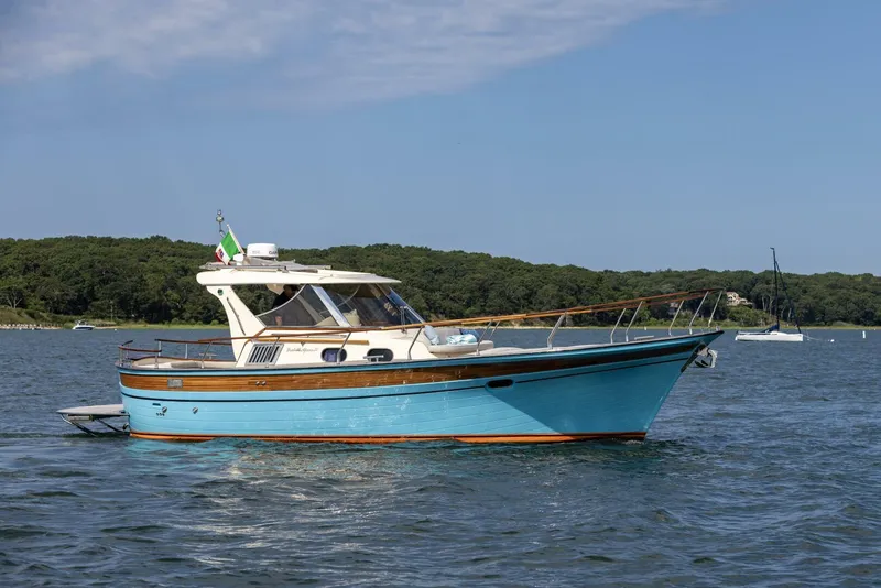 Slide: The Image of 2022 Fratelli Aprea 32 Hard Top boat on calm water, scenic background. - 5