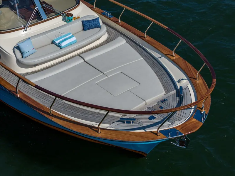Slide: The Image of Fratelli Aprea 32 Hard Top 2022 yacht with elegant deck and cushioned seating. - 7