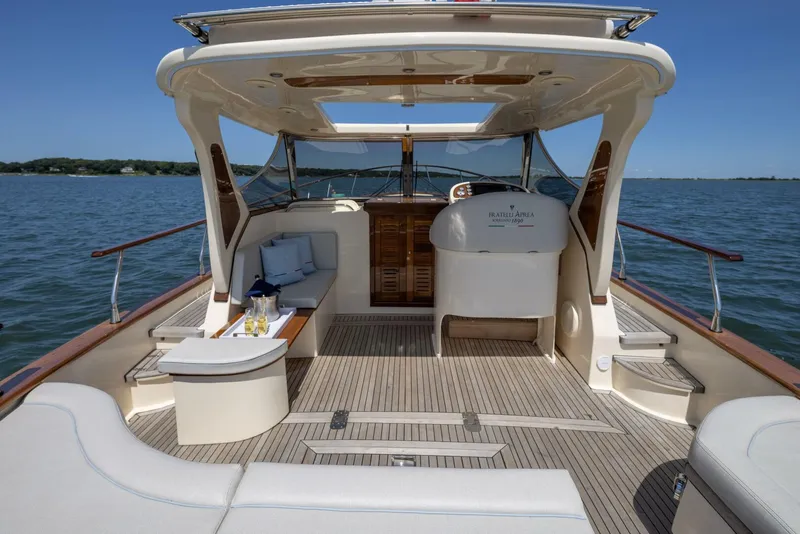 Slide: The Image of Luxurious 2022 Fratelli Aprea 32 Hard Top yacht interior with elegant seating and scenic ocean view. - 9