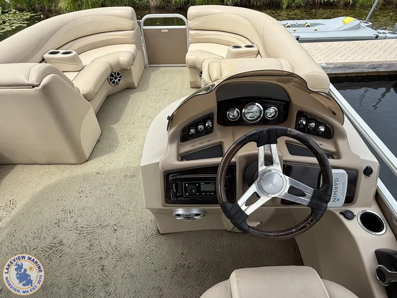Slide: The Image of 2014 Bennington 2250 GSR boat interior with steering wheel and seating area. - 6