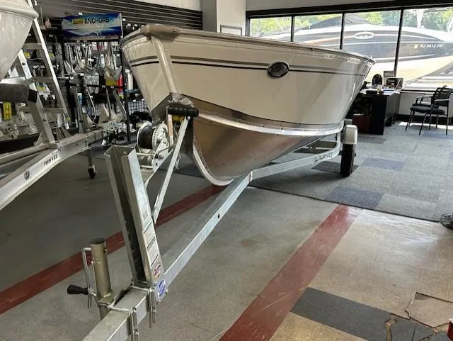 The Image of 2026 Lund 1600 Fury Tiller boat on trailer in showroom. - 0