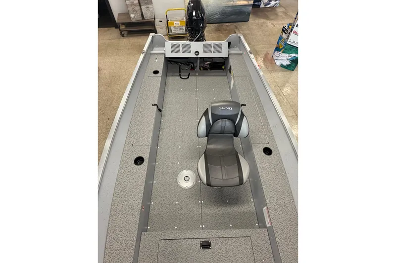 Slide: The Image of 2026 Lund 1600 Fury Tiller boat interior with single seat and motor. - 12