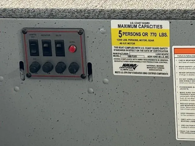 Slide: The Image of 2026 Lund 1600 Fury Tiller boat capacity label, showing maximum 5 persons or 770 lbs. - 15