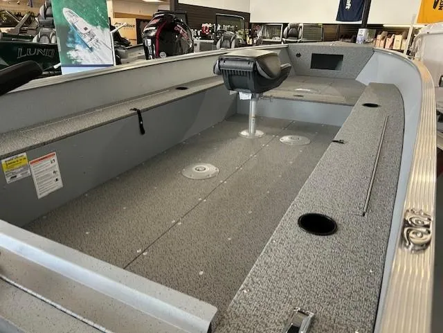 Slide: The Image of 2026 Lund 1600 Fury Tiller boat interior with seating and storage compartments. - 3