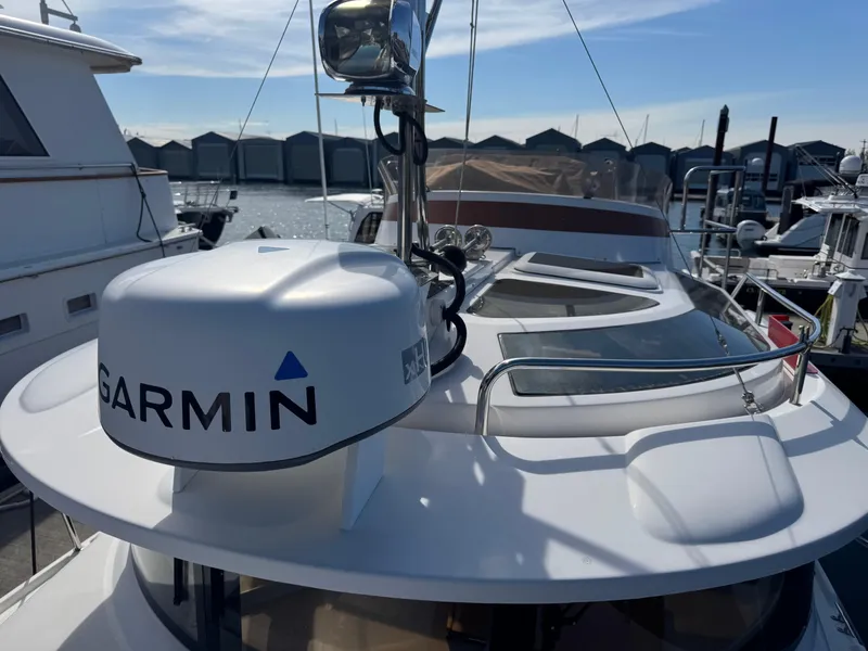 Slide: The Image of Helm of 2019 Ranger Tugs R-29 CB with steering wheel and navigation equipment. - 18