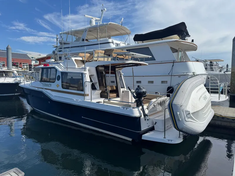 Slide: The Image of 2019 Ranger Tugs R-29 CB boat docked at marina near Fisherman Jacks. - 2