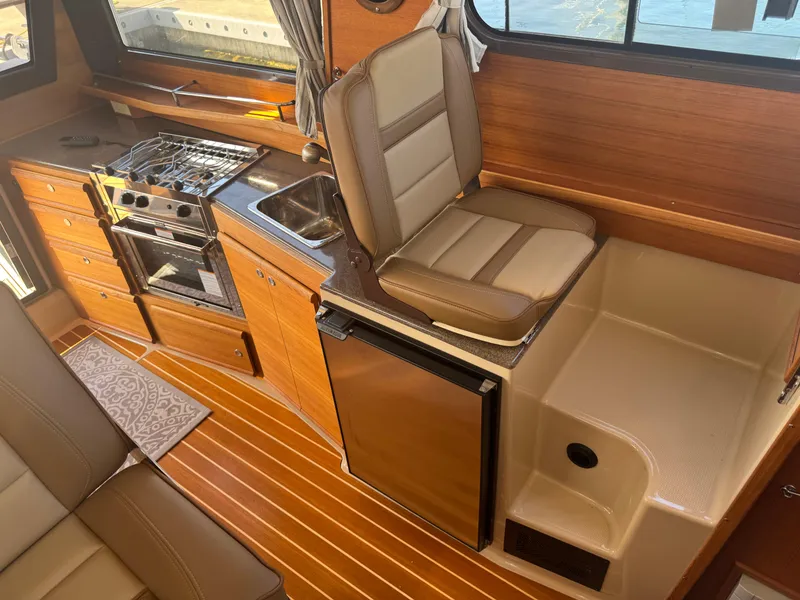 Slide: The Image of Volvo Penta engine display on 2019 Ranger Tugs R-29 CB, showing RPM, hours, and temperature. - 9