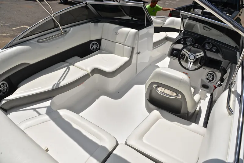 Slide: The Image of 2011 Cobalt 200 boat interior with white seating and modern dashboard. - 19