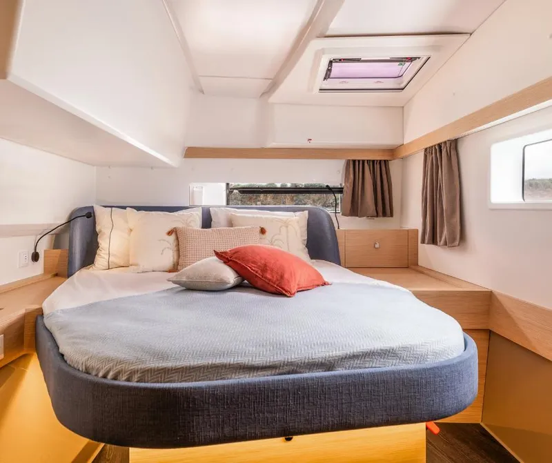 Slide: The Image of Luxurious cabin interior of 2025 Fountaine Pajot NEW 41 catamaran, featuring a cozy bed. - 27
