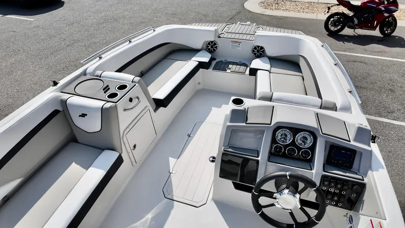 Slide: The Image of 2026 Starcraft SVX 191 OB boat interior with modern dashboard and seating. - 10