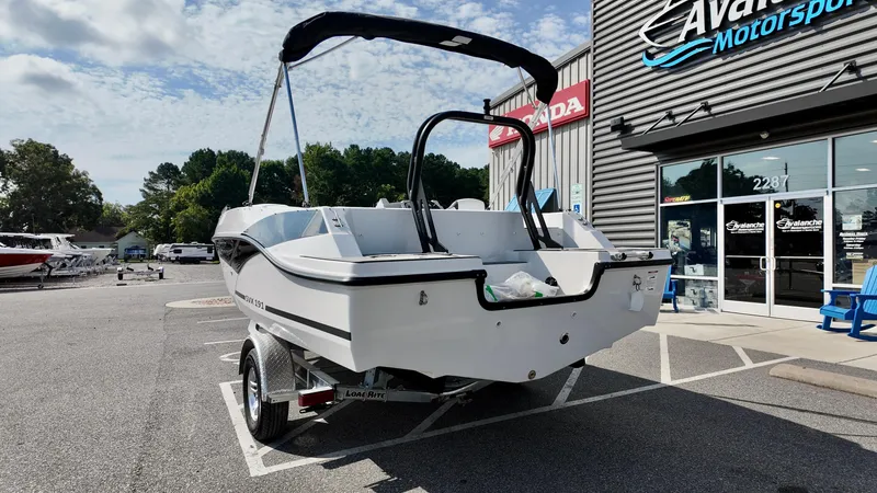 Slide: The Image of 2026 Starcraft SVX 191 OB boat on trailer outside dealership. - 14