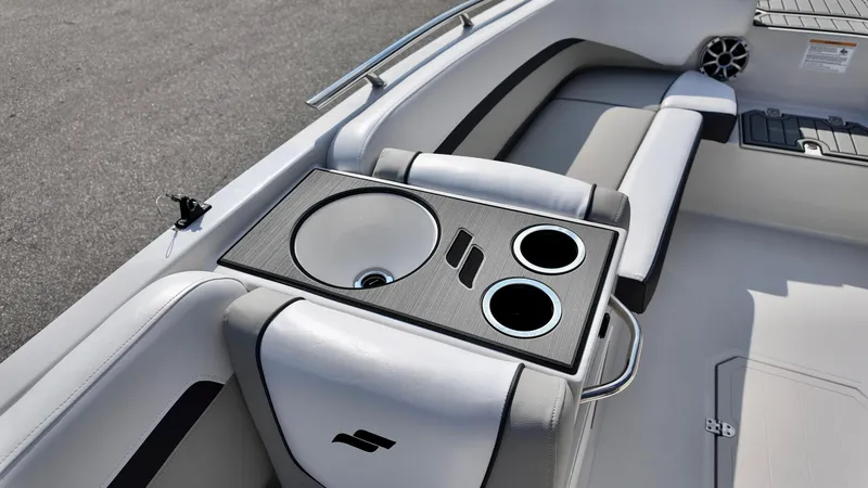 Slide: The Image of 2026 Starcraft SVX 191 OB boat interior with cup holders and seating area. - 6