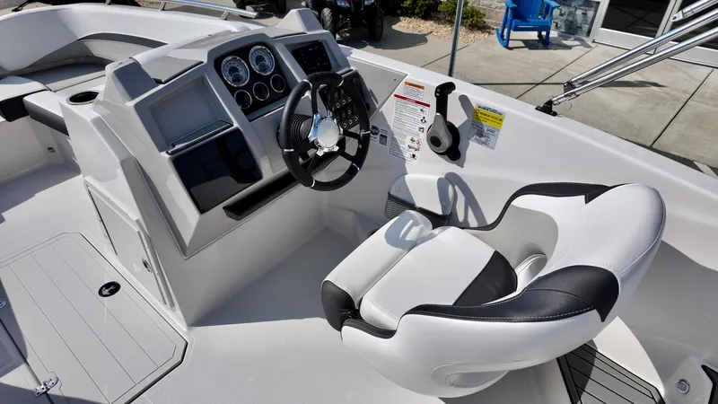 Slide: The Image of 2026 Starcraft SVX 191 OB boat cockpit with modern steering and controls. - 8