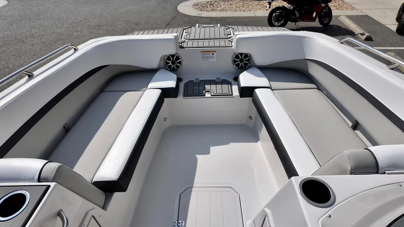 Slide: The Image of 2026 Starcraft SVX 191 OB boat interior with spacious seating and cup holders. - 9