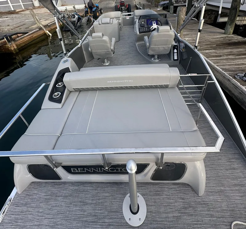 Slide: The Image of 2024 Bennington R 23 Swingback pontoon boat with spacious seating and modern design. - 6