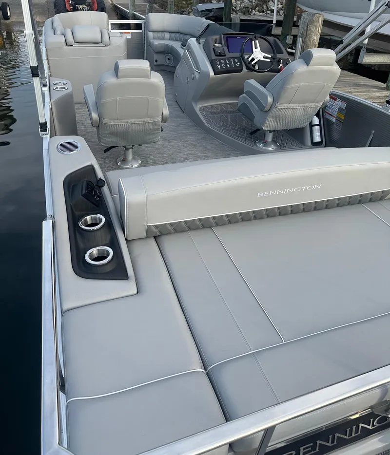 Slide: The Image of 2024 Bennington R 23 Swingback pontoon boat with luxurious seating and modern helm. - 7