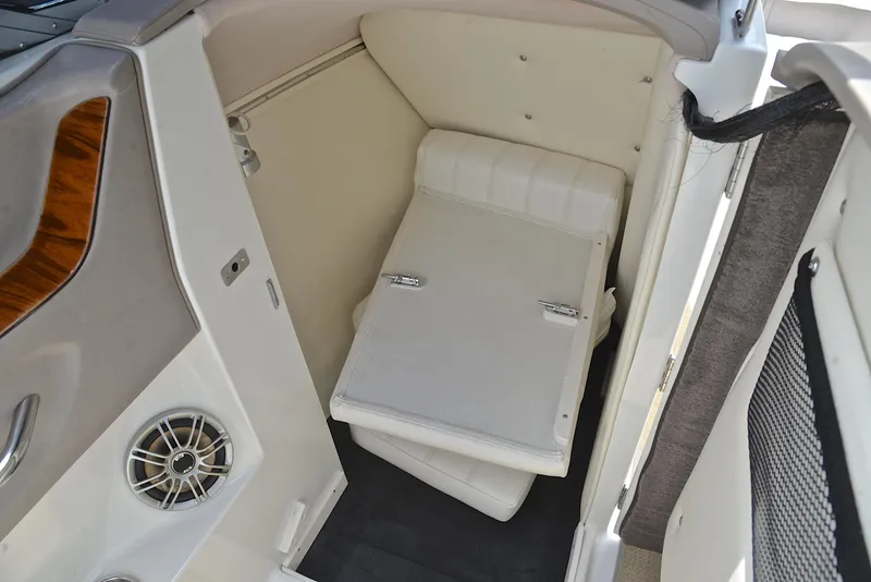 Slide: The Image of Interior cabin of a 2000 Cobalt 246 boat with seating and speaker. - 29