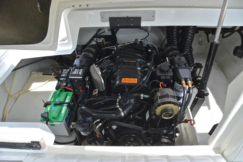 Slide: The Image of Engine compartment of a 2000 Cobalt 246 boat, featuring a Volvo Penta engine. - 30