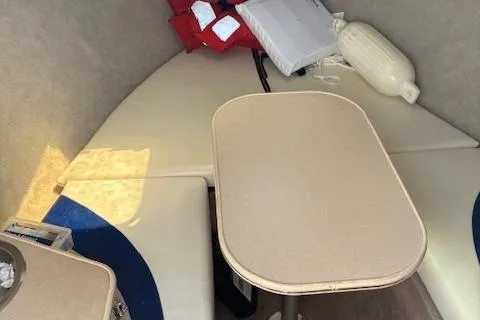 Slide: The Image of Interior cabin of 1995 Wellcraft 23 Excel boat with seating and table. - 14