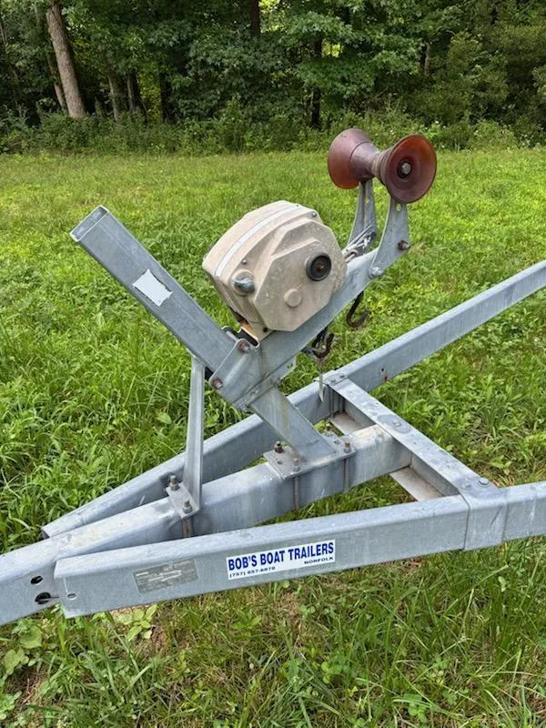 Slide: The Image of Boat trailer winch on grass, labeled "Bob's Boat Trailers," for 1995 Wellcraft 23 Excel. - 19
