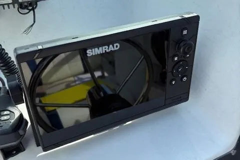 Slide: The Image of Simrad marine display on 1995 Wellcraft 23 Excel boat dashboard. - 5