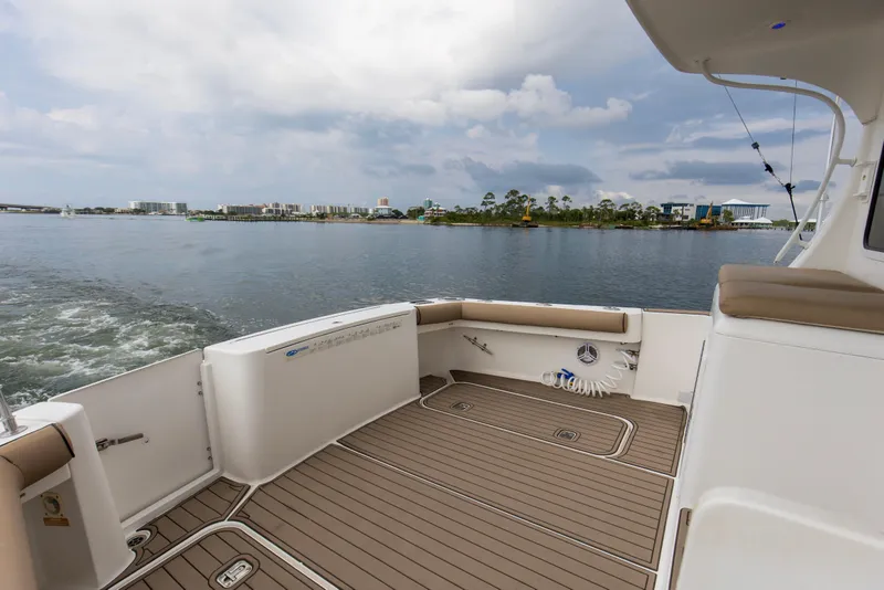 Slide: The Image of 2008 Luhrs 35 Convertible boat deck with scenic waterfront view. - 24