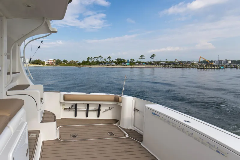 Slide: The Image of 2008 Luhrs 35 Convertible boat deck with scenic waterfront view. - 25