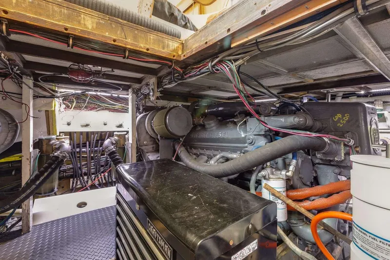 Slide: The Image of Engine room of 1973 Hatteras 58 Tricabin flushdeck MY, showcasing mechanical components and wiring. - 35