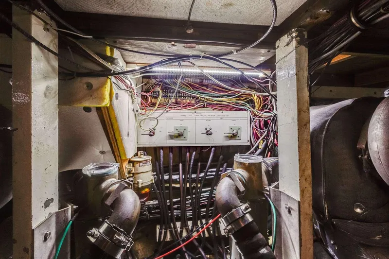 Slide: The Image of Engine room of 1973 Hatteras 58 Tricabin flushdeck MY with wiring and control panel. - 36