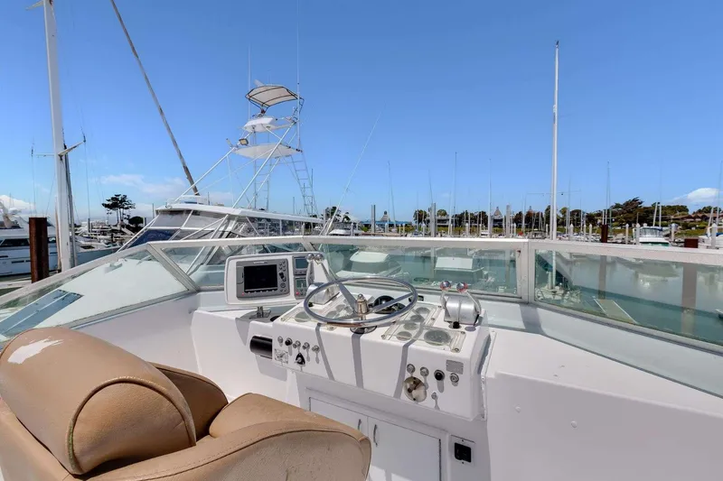 Slide: The Image of 1973 Hatteras 58 Tricabin flushdeck MY helm with marina view. - 40