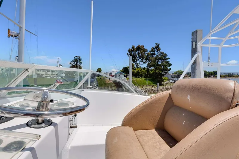 Slide: The Image of 1973 Hatteras 58 Tricabin flushdeck MY helm with tan seat and steering wheel. - 41