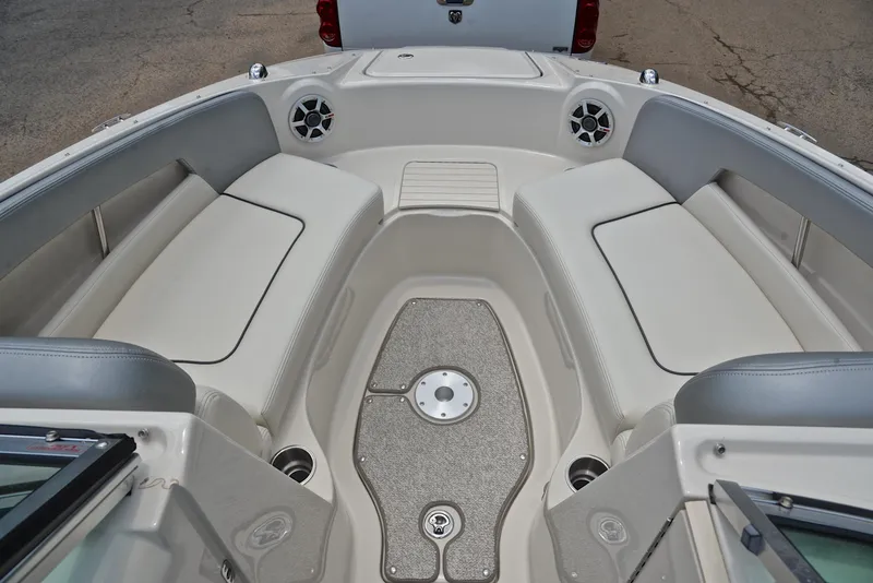 Slide: The Image of 2009 Sea Ray 210 Sundeck interior with spacious seating and modern design. - 21