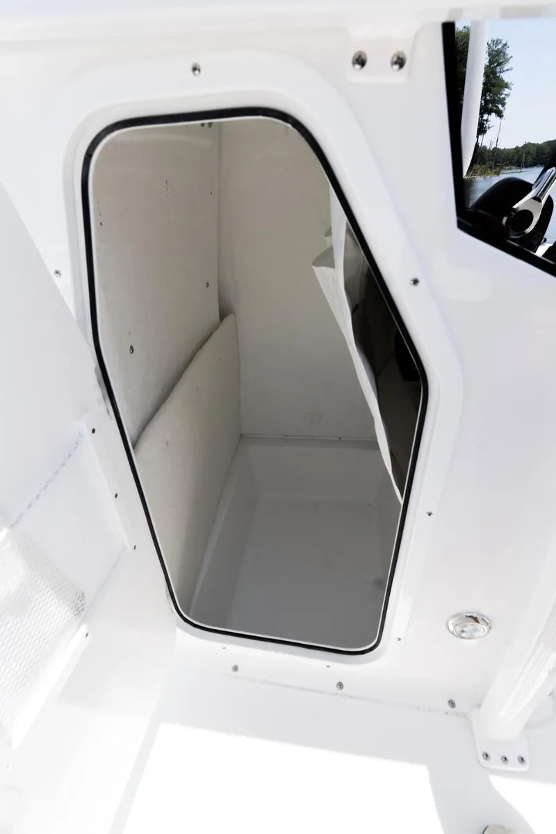 Slide: The Image of 2025 Sea Hunt Ultra 219 boat interior storage compartment. - 10