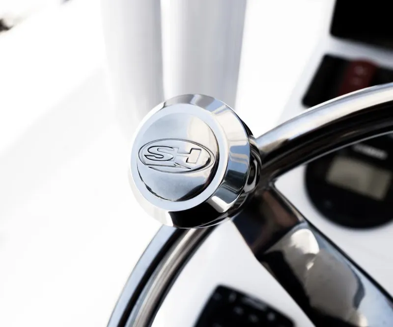 Slide: The Image of Close-up of 2025 Sea Hunt Ultra 219 steering wheel with SH logo. - 7