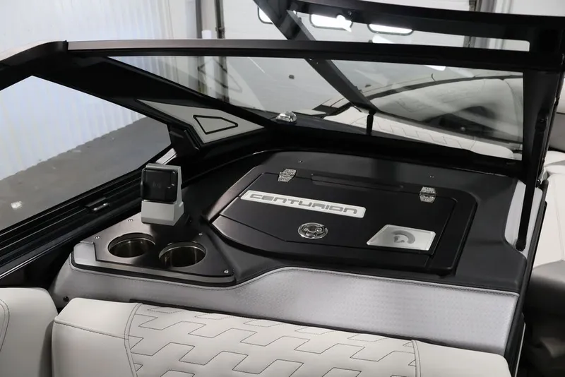 Slide: The Image of Interior of 2026 Centurion Ri245 boat with sleek dashboard and cup holders. - 27