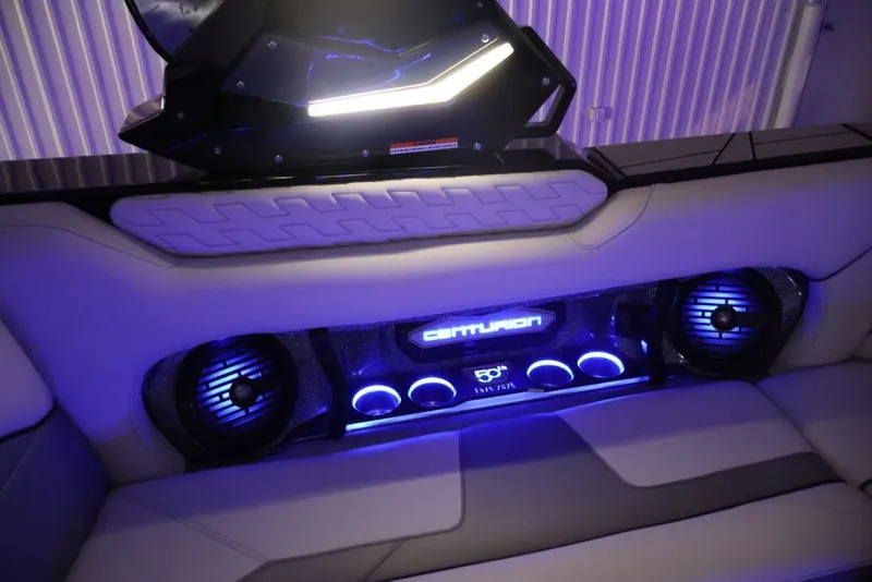 Slide: The Image of 2026 Centurion Ri245 boat interior with illuminated speakers and modern design. - 64